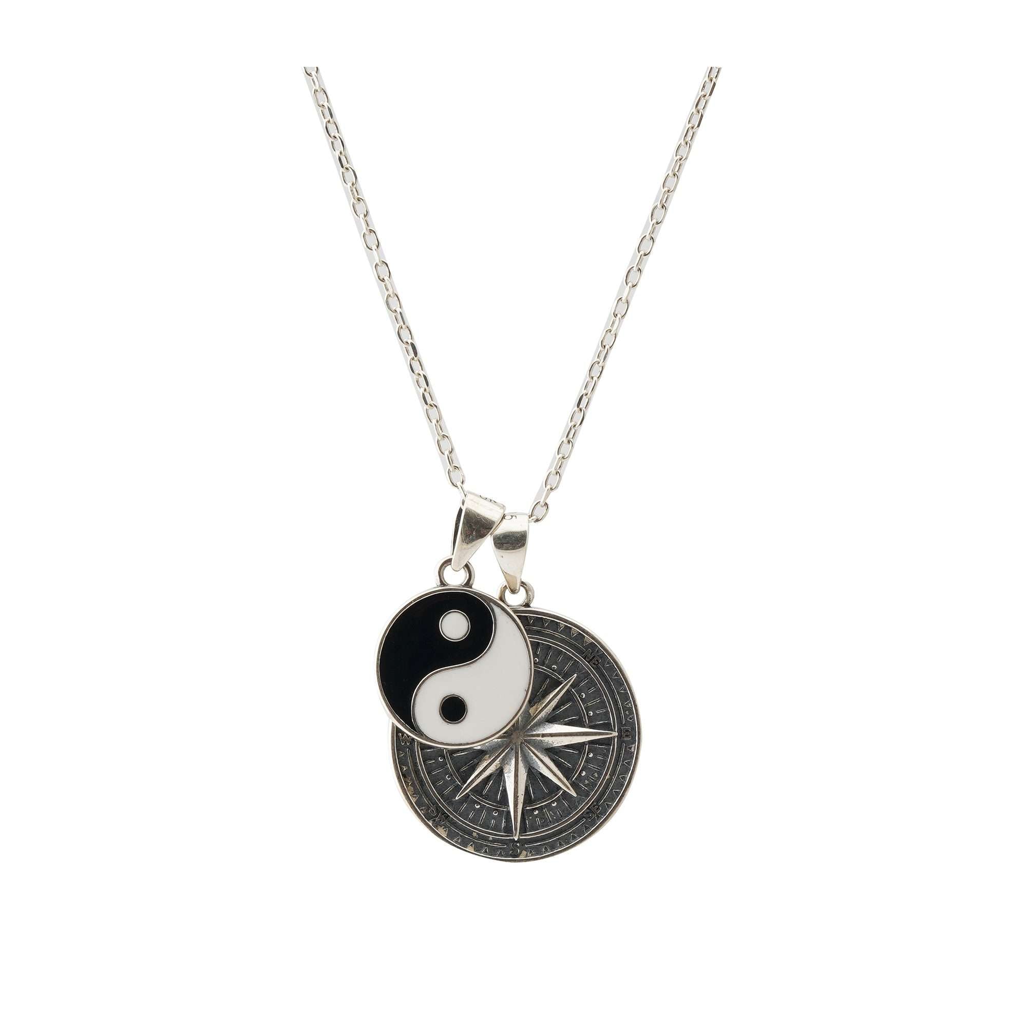 Compass-themed necklace featuring "Only Way is Forward." Spanish translation on the back.