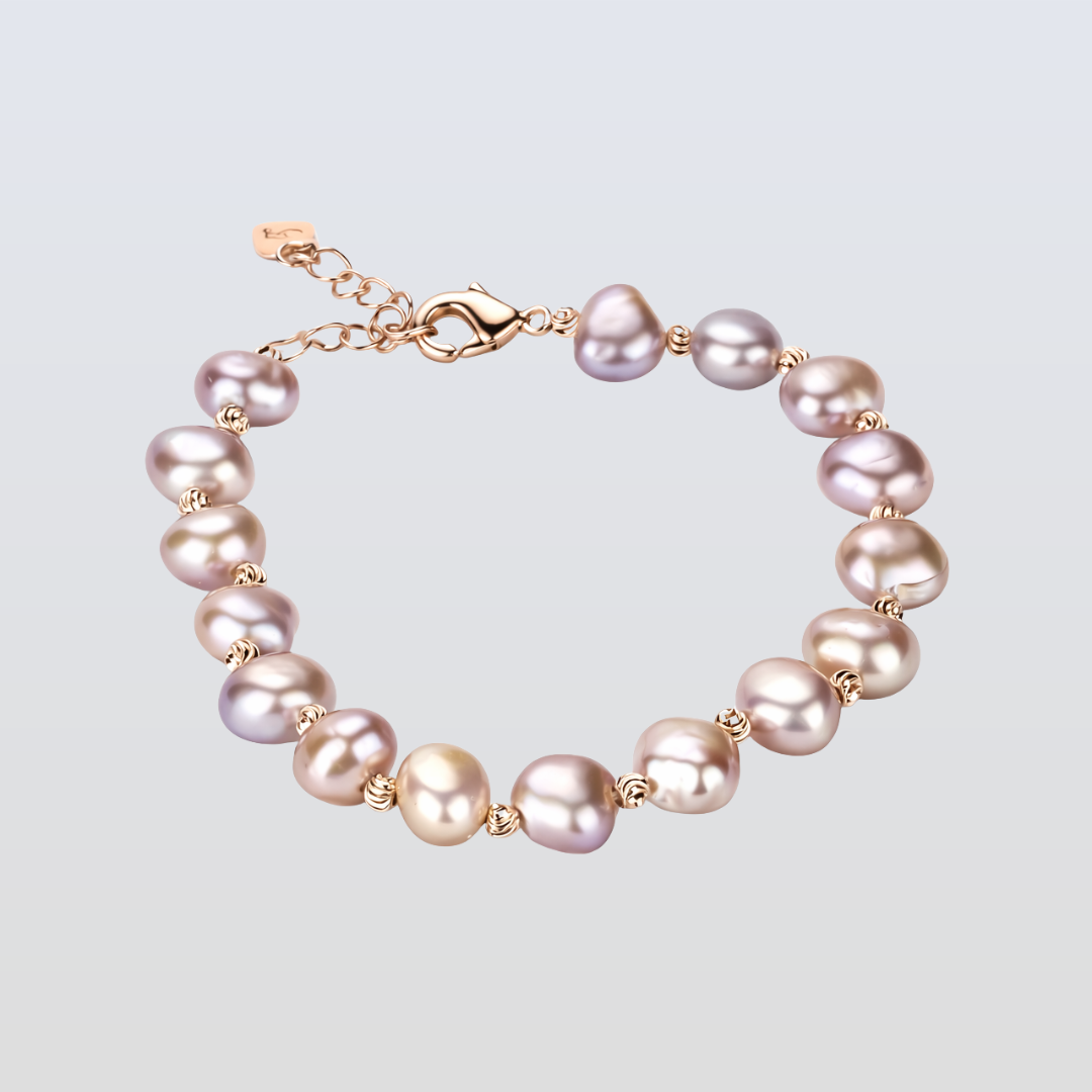 Pearl bracelet with gold accents on a light gray background
