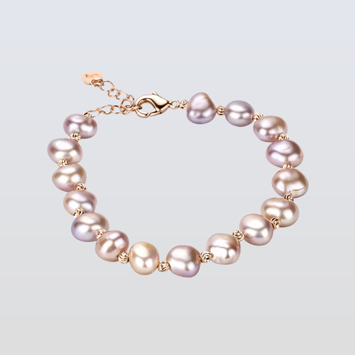 Pearl bracelet with gold accents on a light gray background