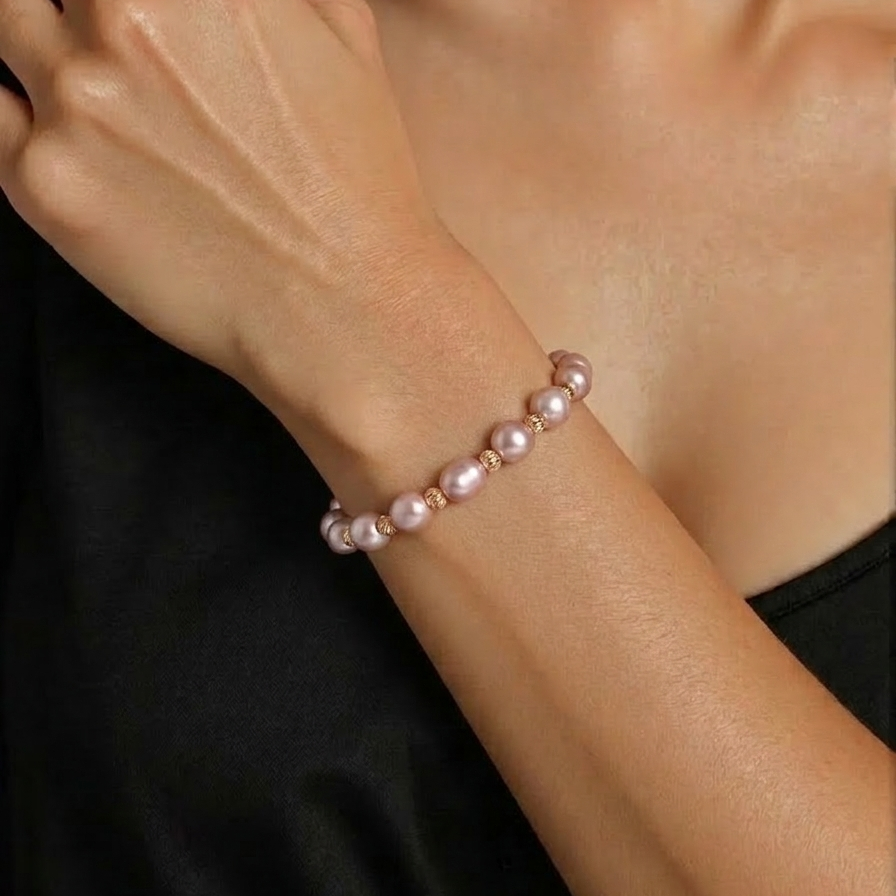Pearl bracelet on a person's wrist with a blurred background