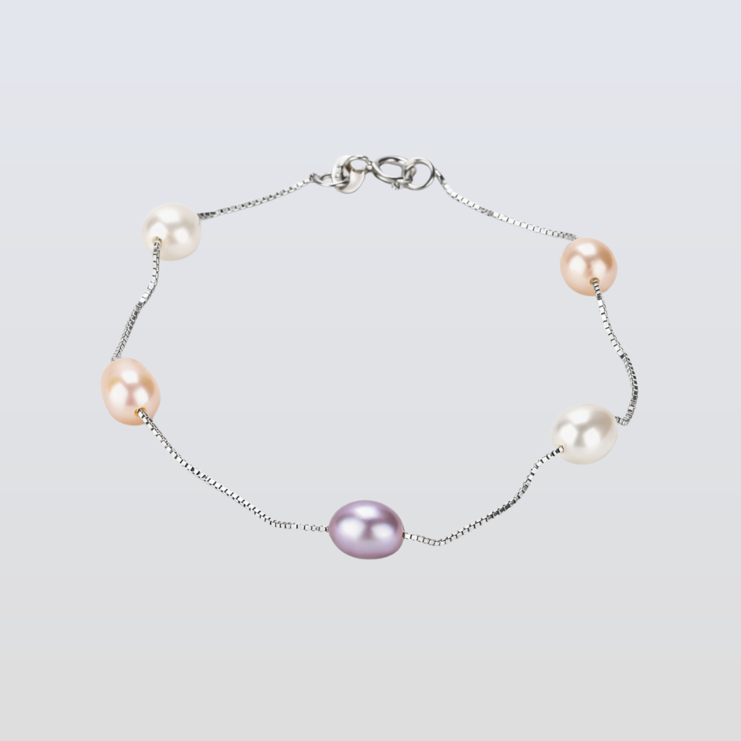 Pearl bracelet with pink and purple pearls on a light gray background