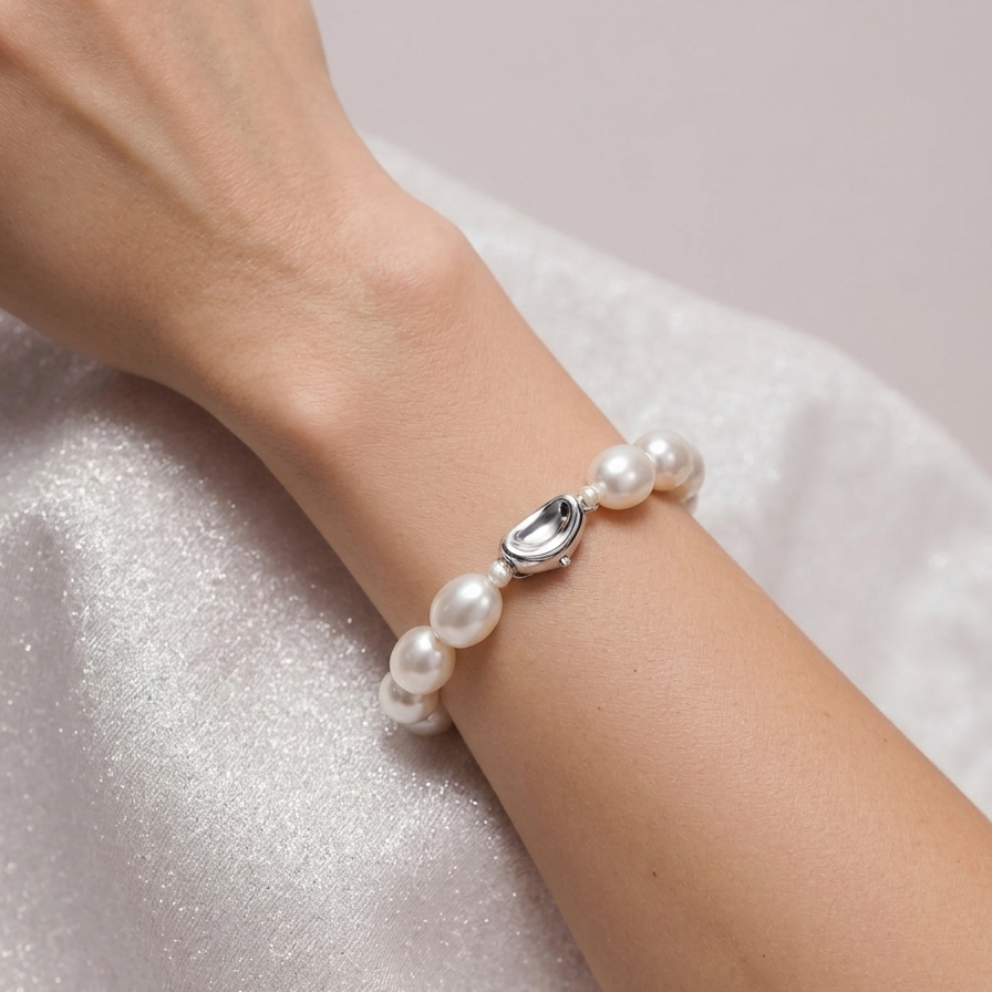 Pearl bracelet on a wrist with a soft background