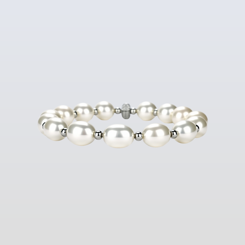 Pearl bracelet with silver accents on a light gray background