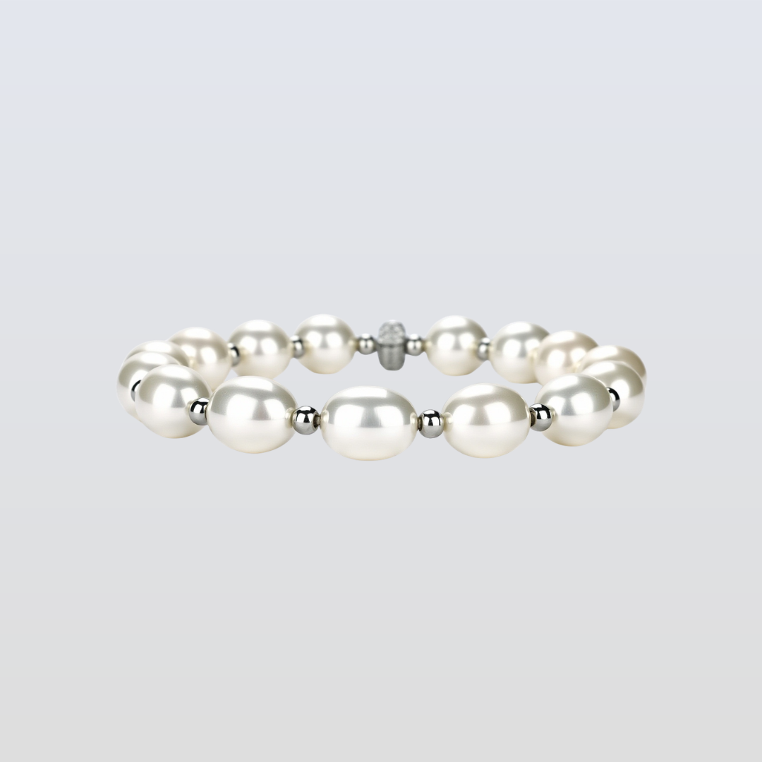 Pearl bracelet with silver accents on a light gray background