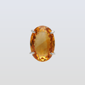 Gold pendant with a large orange gemstone on a light gray background