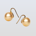 Pair of pearl earrings on a light gray background