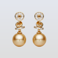 Pair of gold earrings with spherical designs on a light gray background