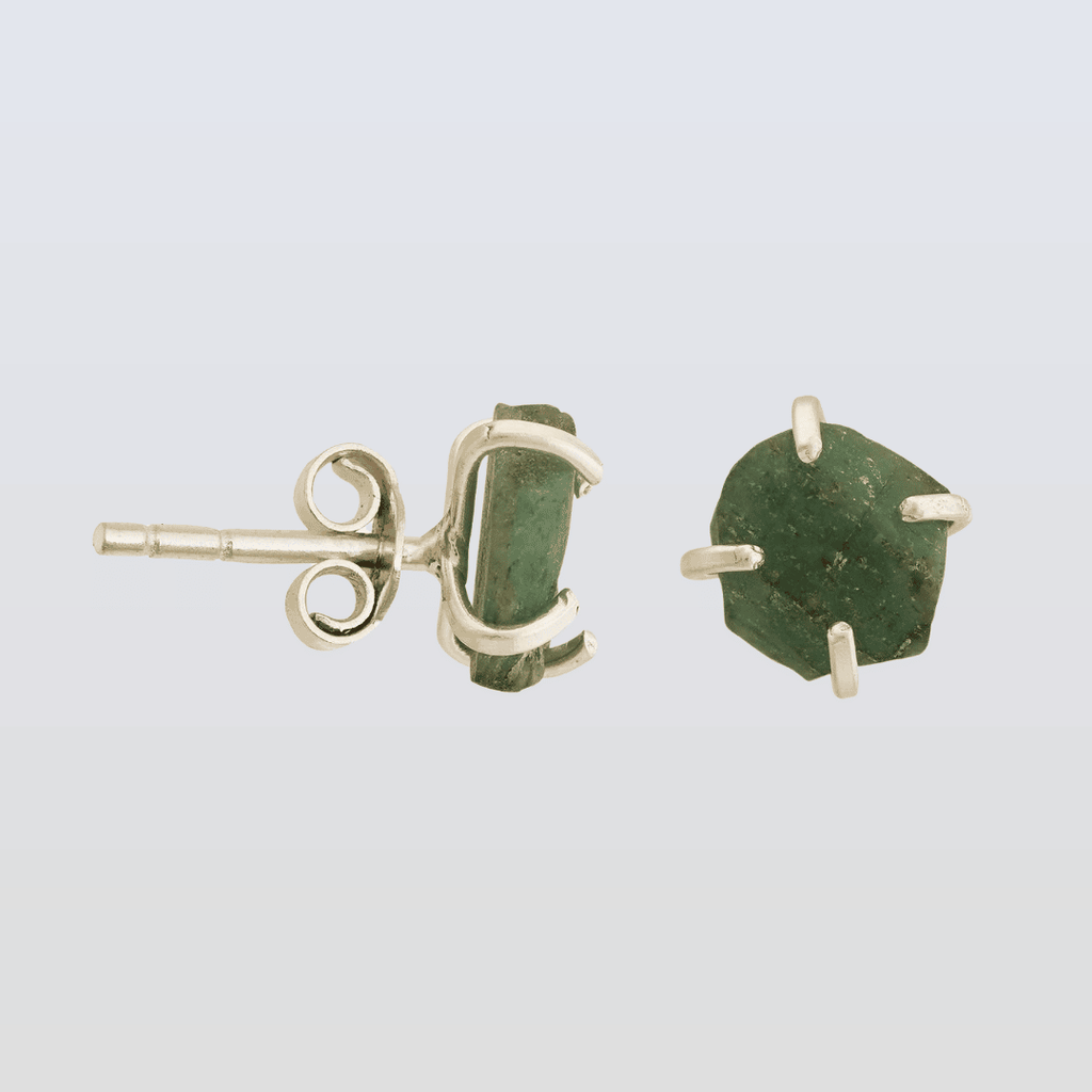 Green stone stud earrings on a light gray background