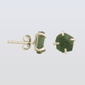 Green stone stud earrings on a light gray background