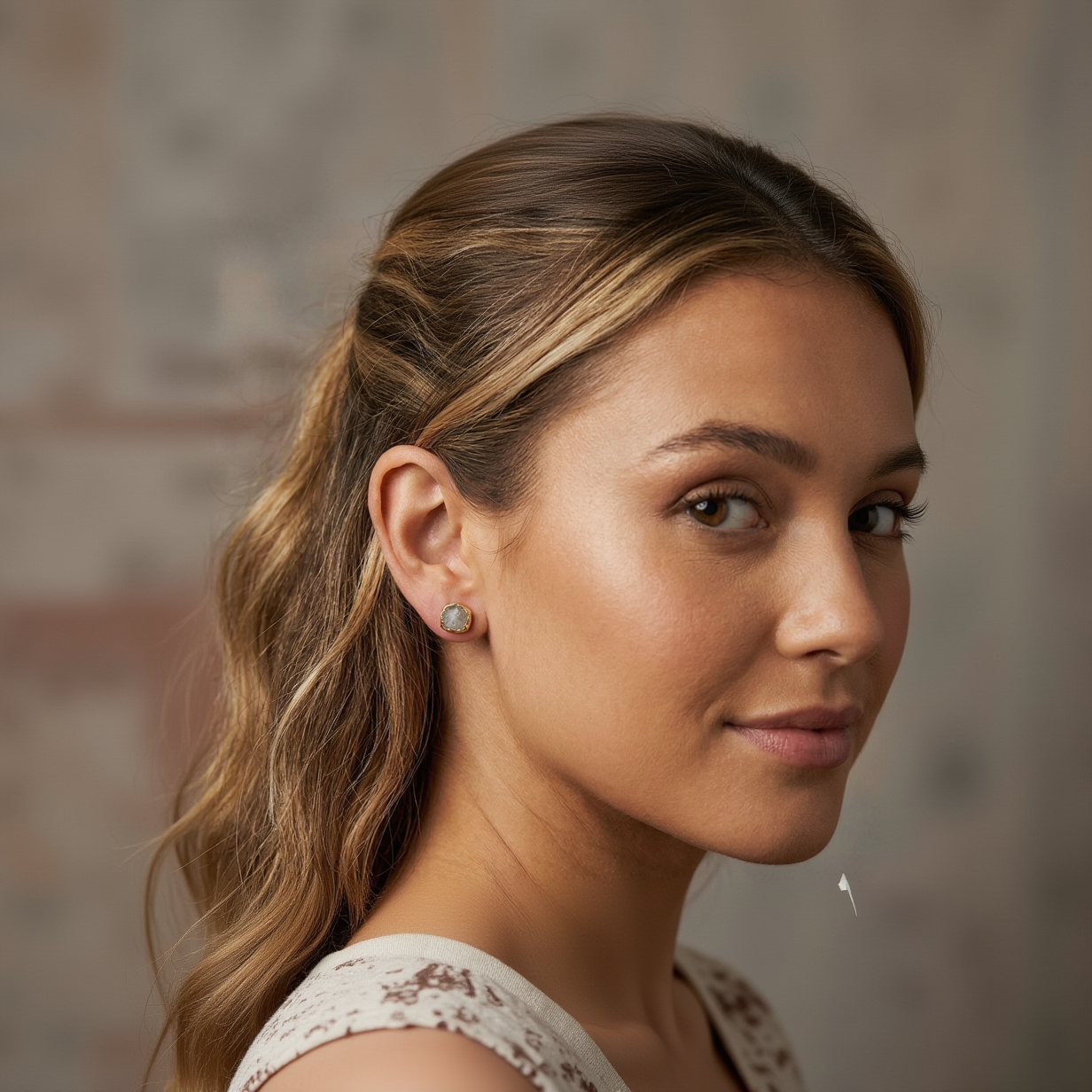 Close-up of a woman wearing earrings with a blurred background