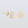 light pink stone stud earrings on a light gray background