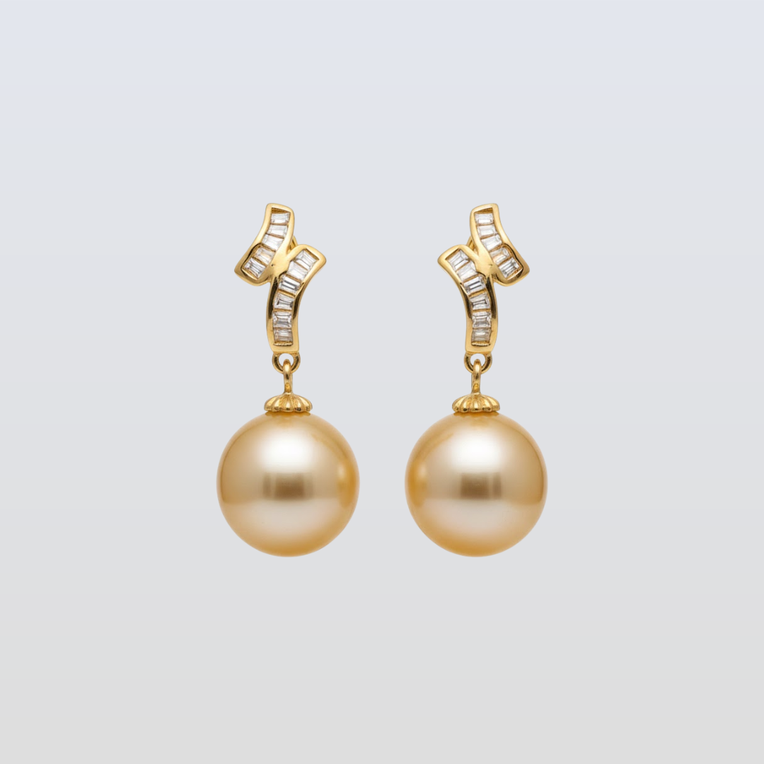 Pair of gold earrings with pearls and small diamonds on a light gray background