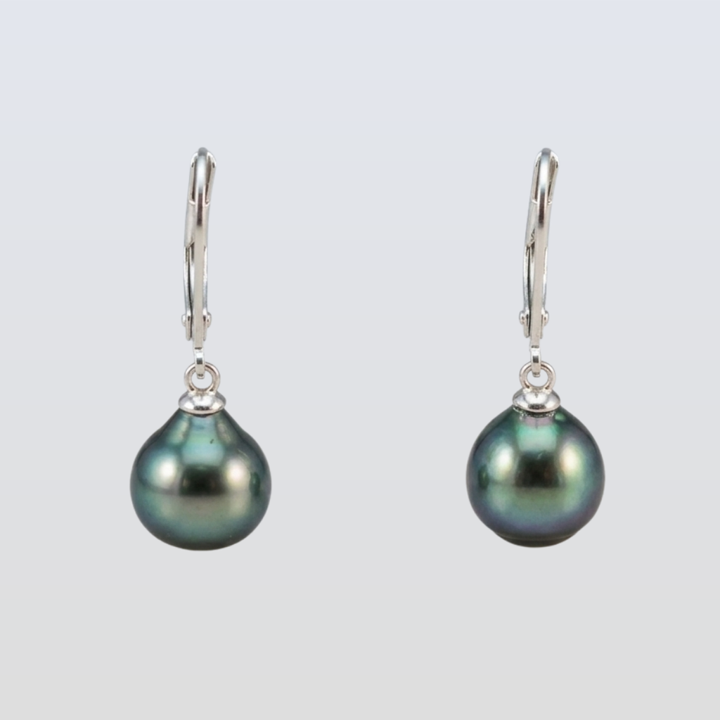 Pair of black pearl earrings on a light gray background