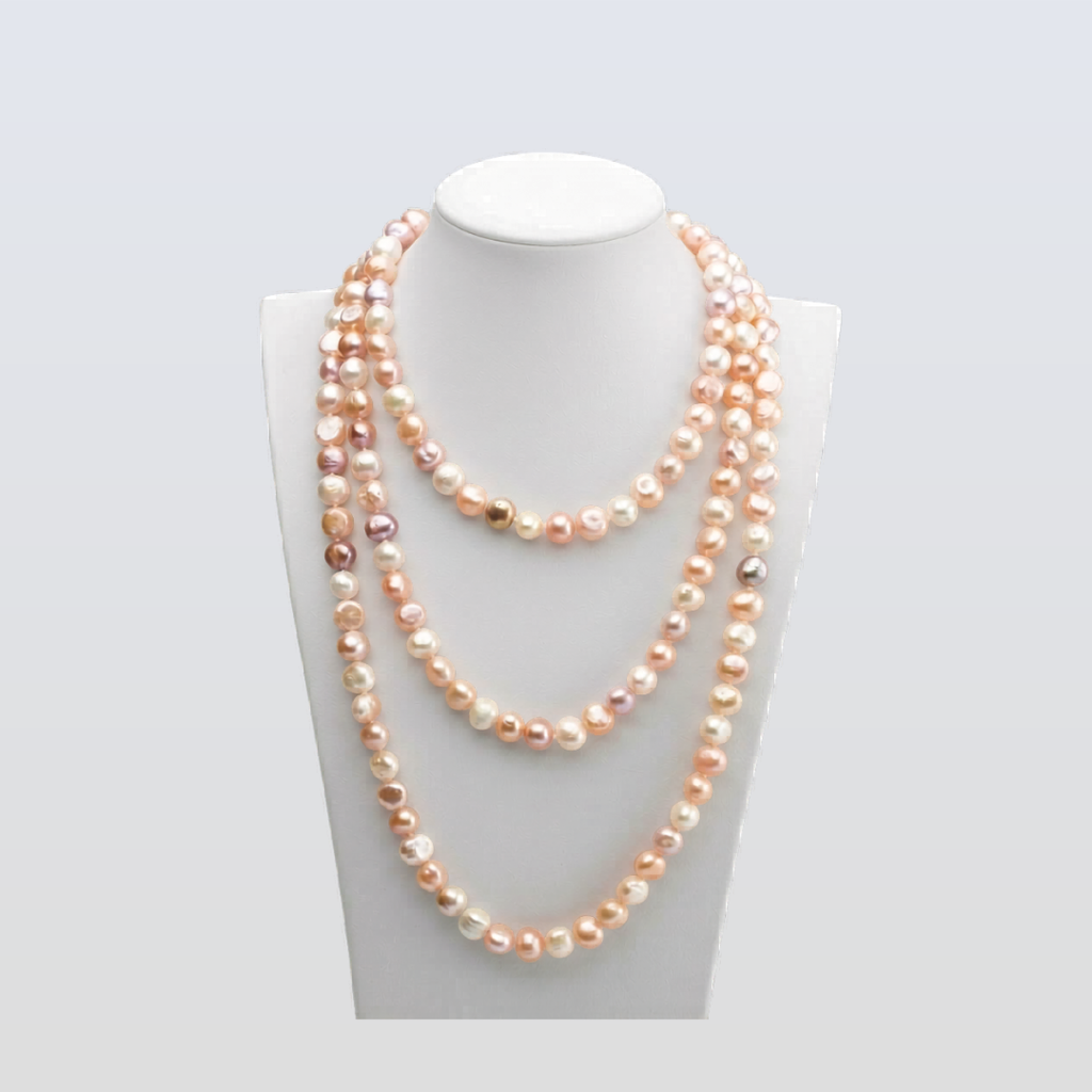 Two layered pearl necklaces on a mannequin bust against a white background