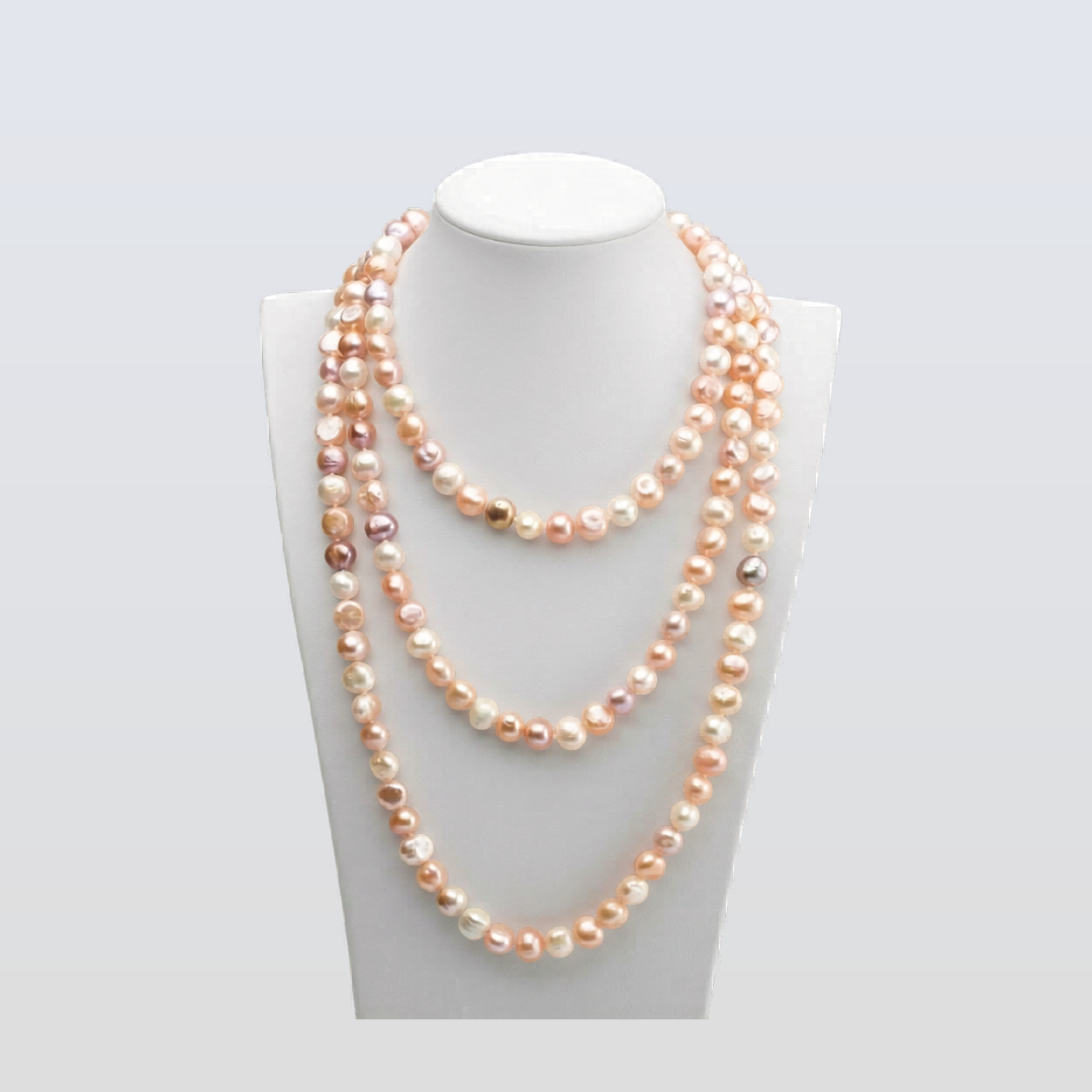 Two layered pearl necklaces on a mannequin bust against a white background