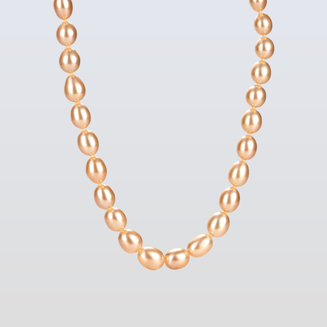 Necklace with pink pearls on a light gray background