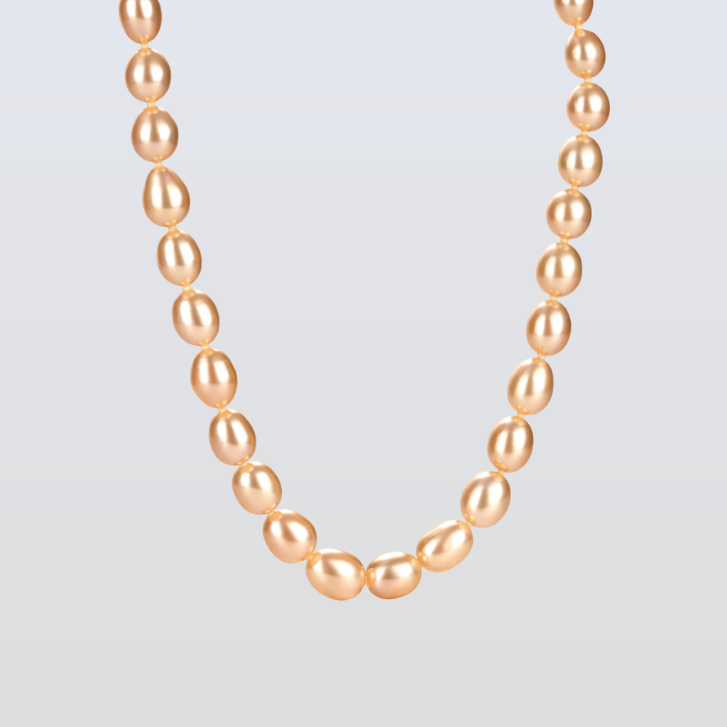 Necklace with pink pearls on a light gray background