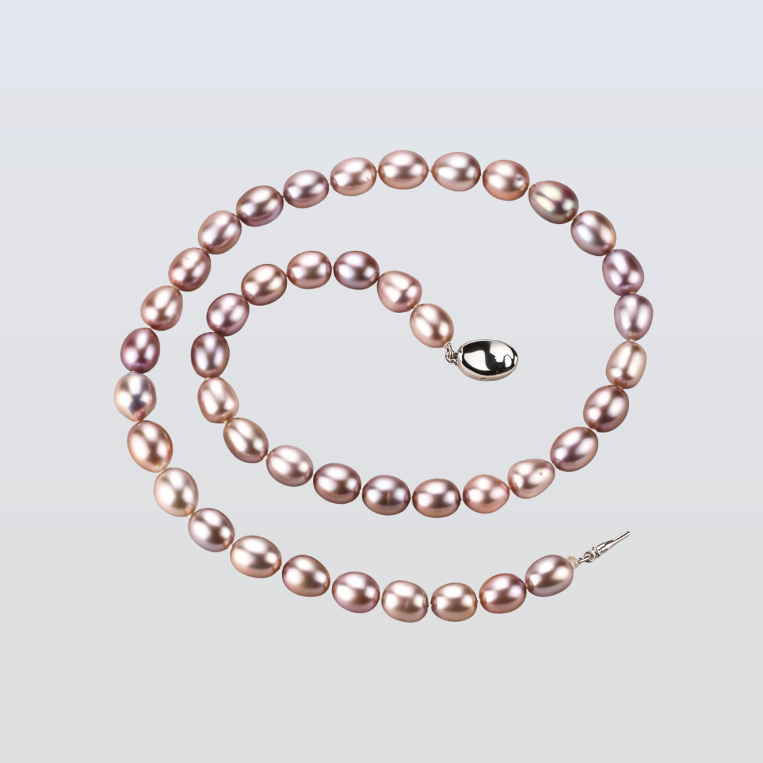 Pink pearl necklace on a light gray background