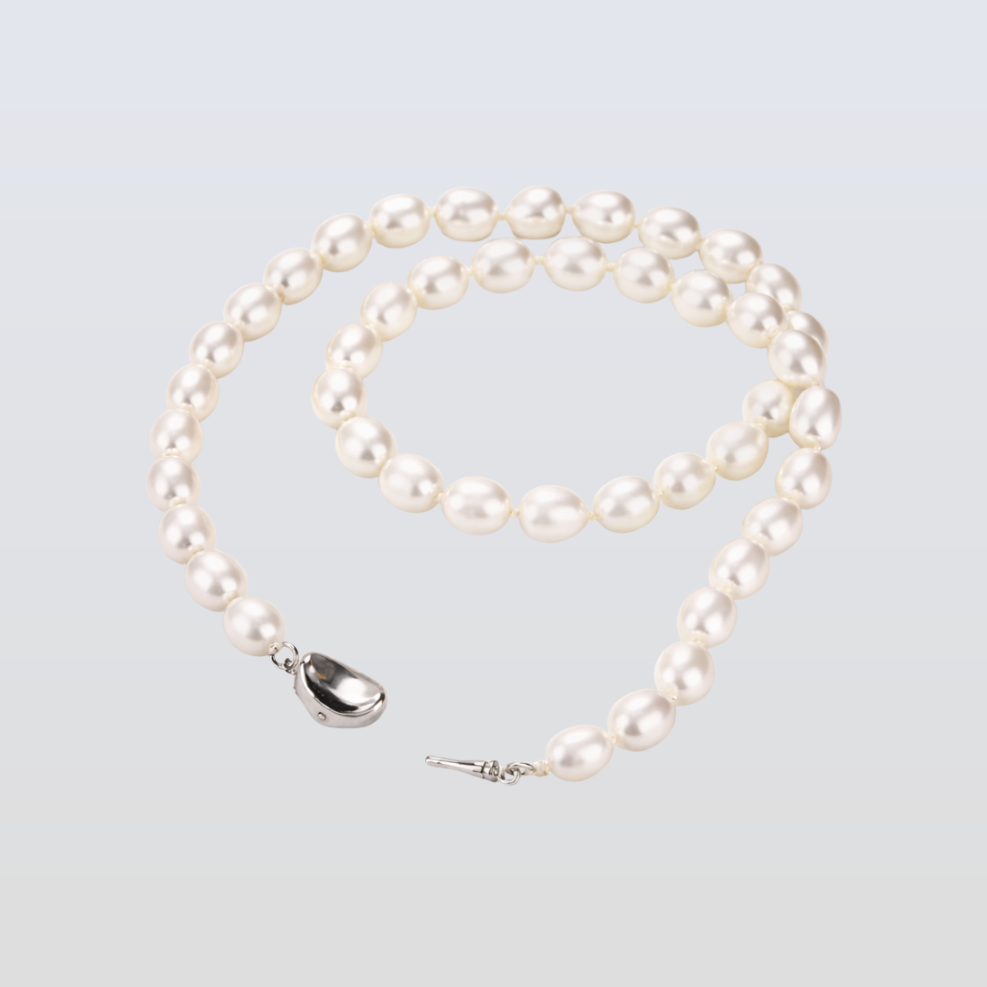 Pearl necklace with a silver clasp on a light gray background