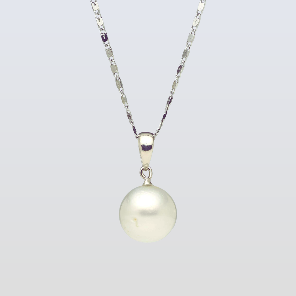 Pearl necklace with a silver chain on a light gray background