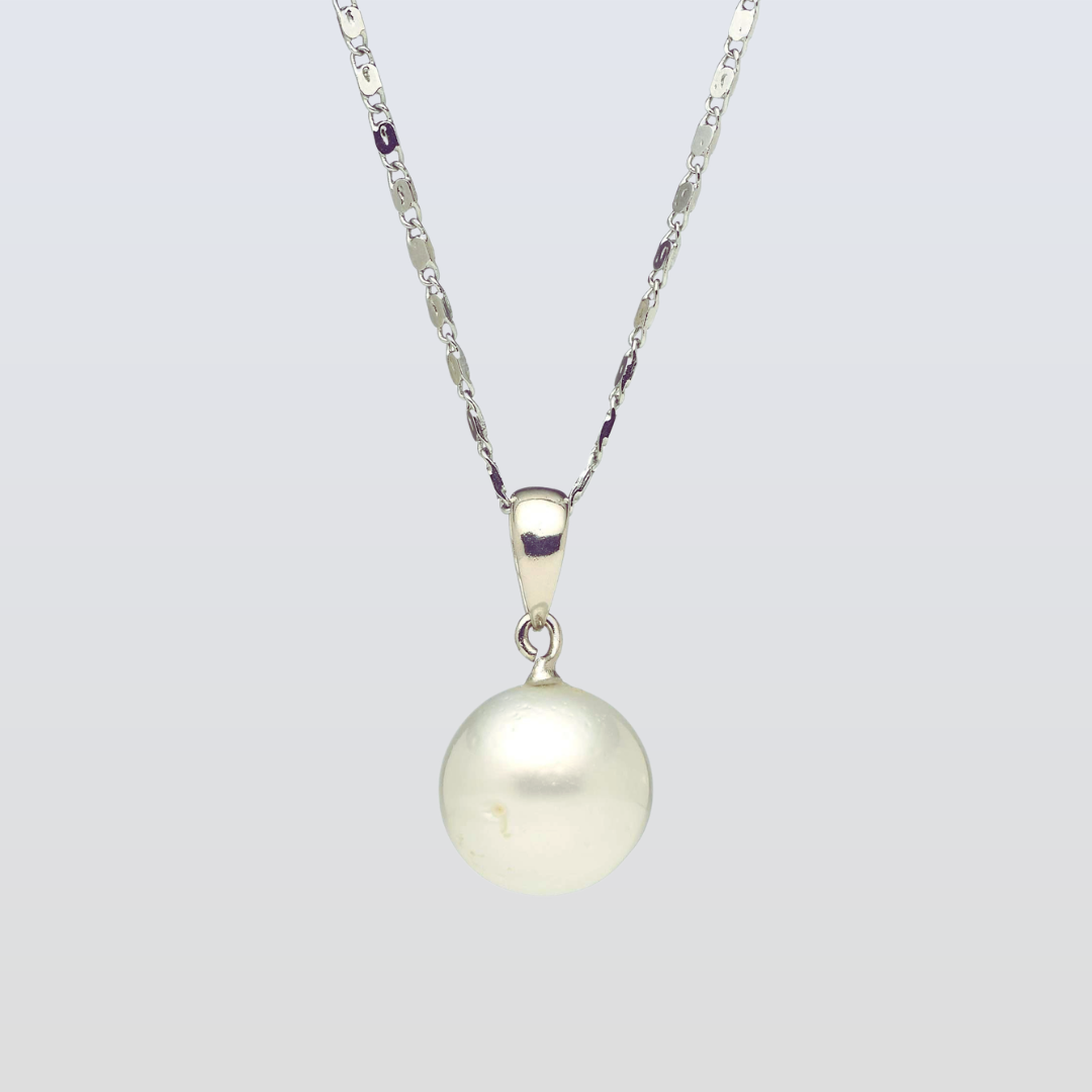 Pearl necklace with a silver chain on a light gray background