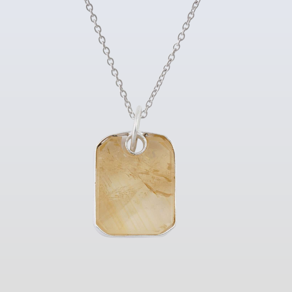Necklace with a rectangular pendant on a light gray background