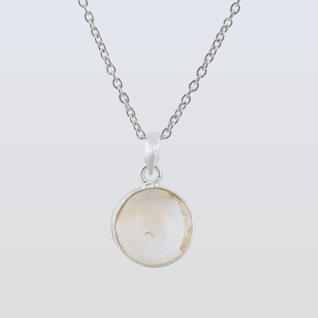 Necklace with a round pendant on a light gray background