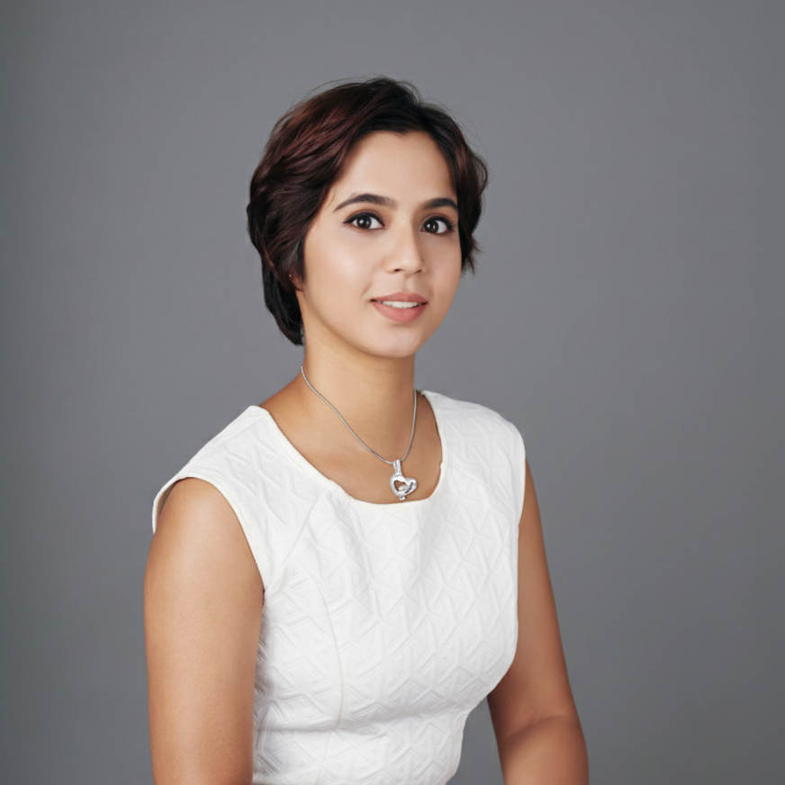 Woman wearing a white sleeveless top against a gray background