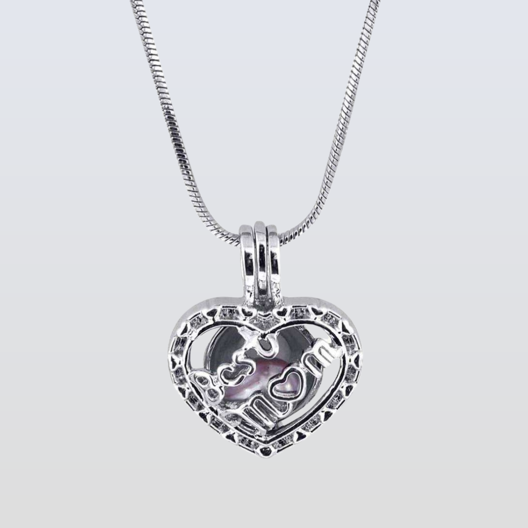 Silver heart-shaped pendant with 'Mom' engraved on a light gray background