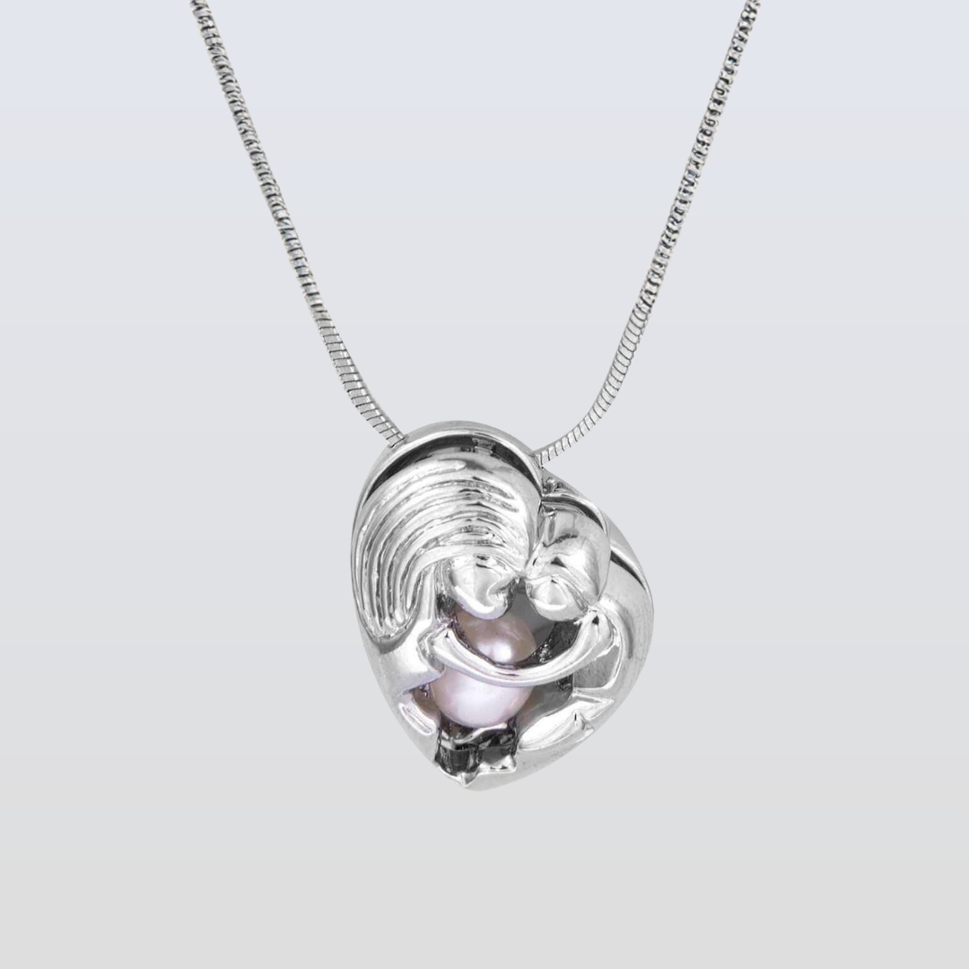 Silver necklace with a heart-shaped pendant on a light gray background