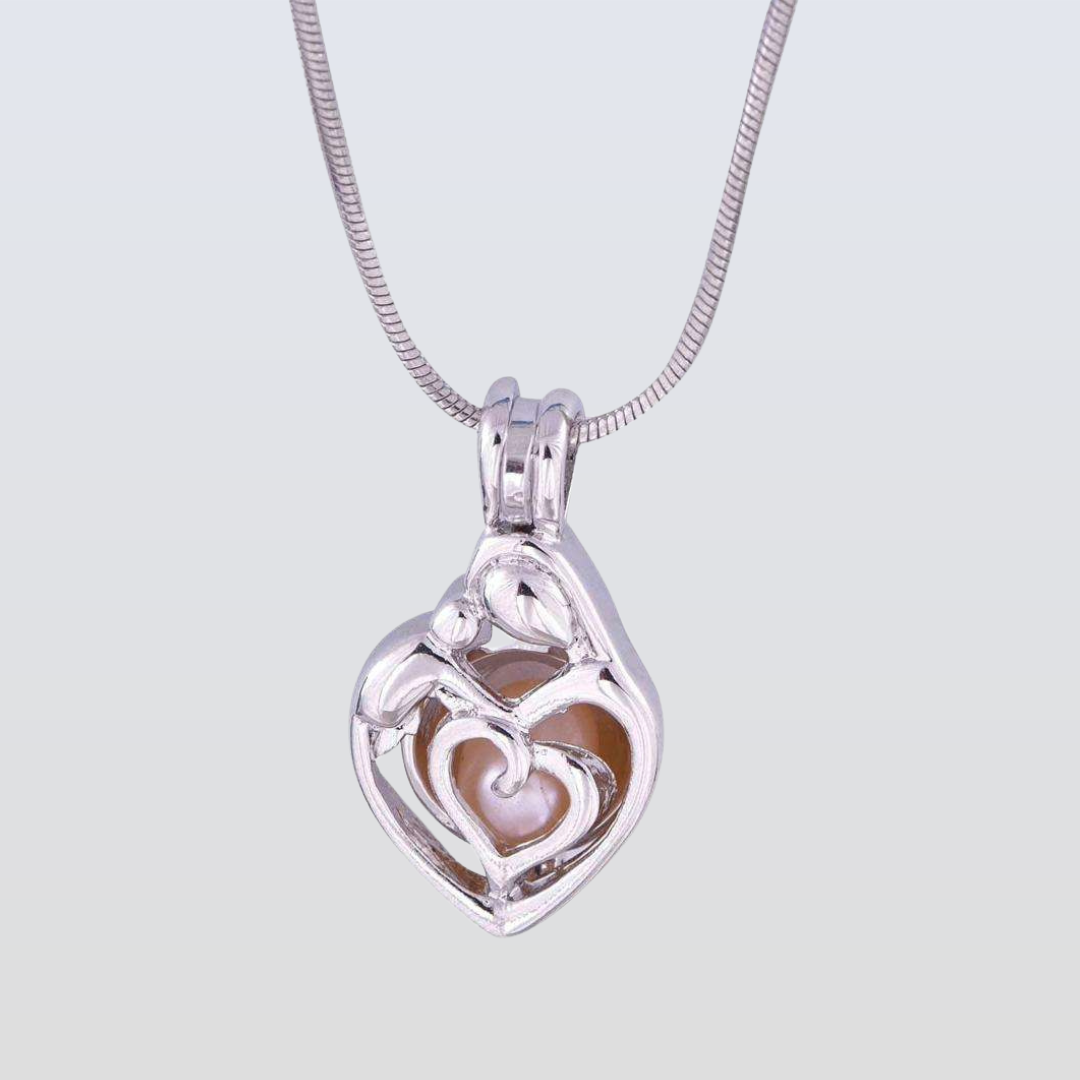 Silver heart-shaped pendant with a pearl on a light gray background