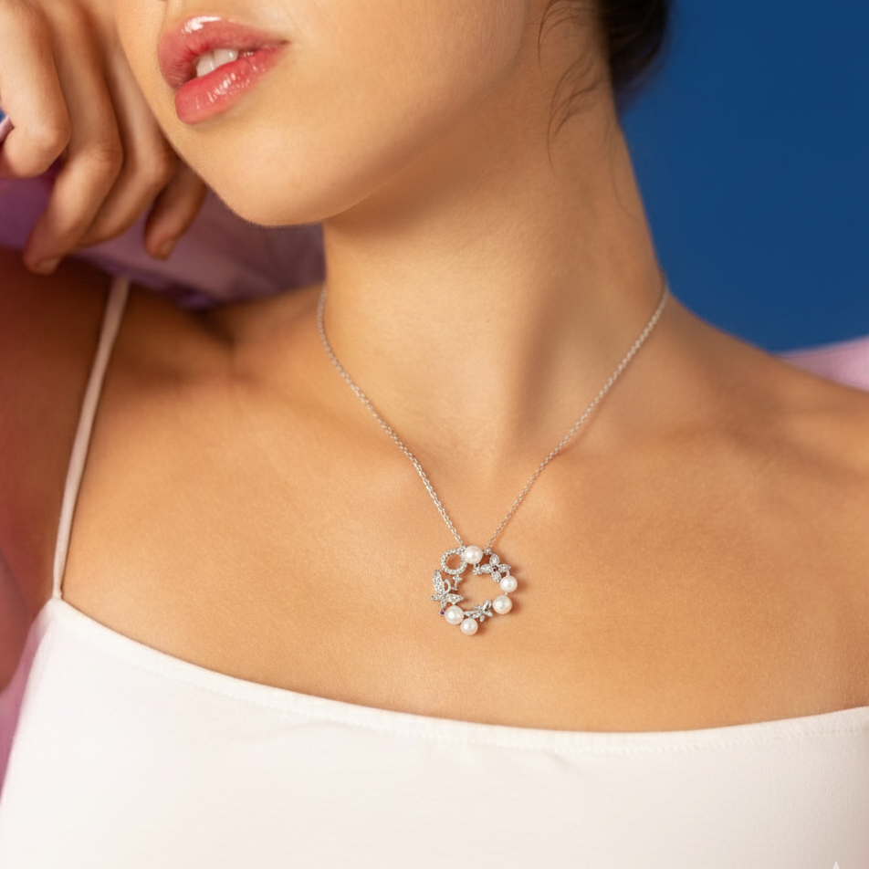Necklace with a circular pendant worn by a model against a blue background
