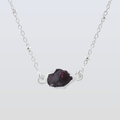Necklace with a dark purple gemstone on a light gray background Garnet Pendants in 925 Silver