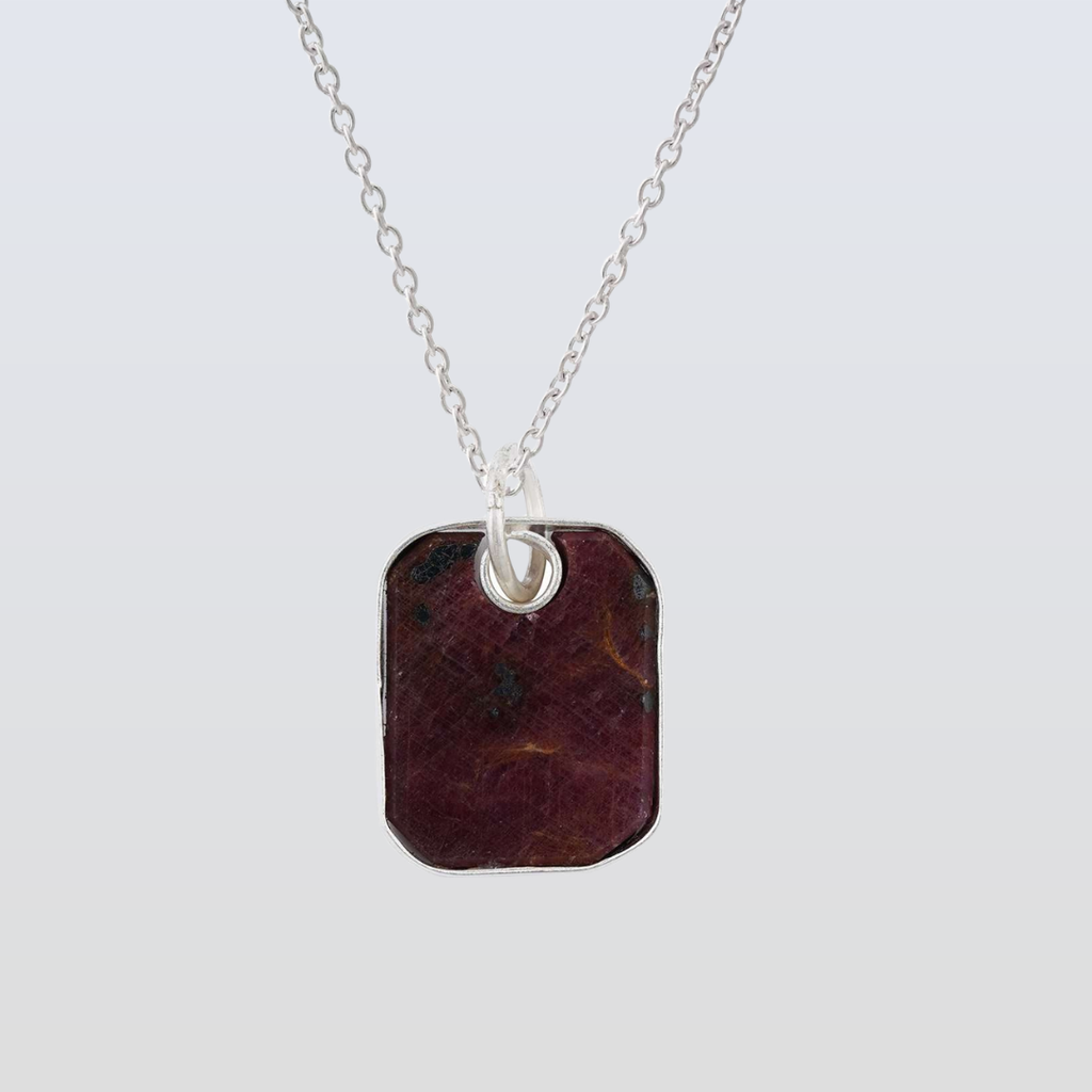 Necklace with a rectangular pendant on a light gray background