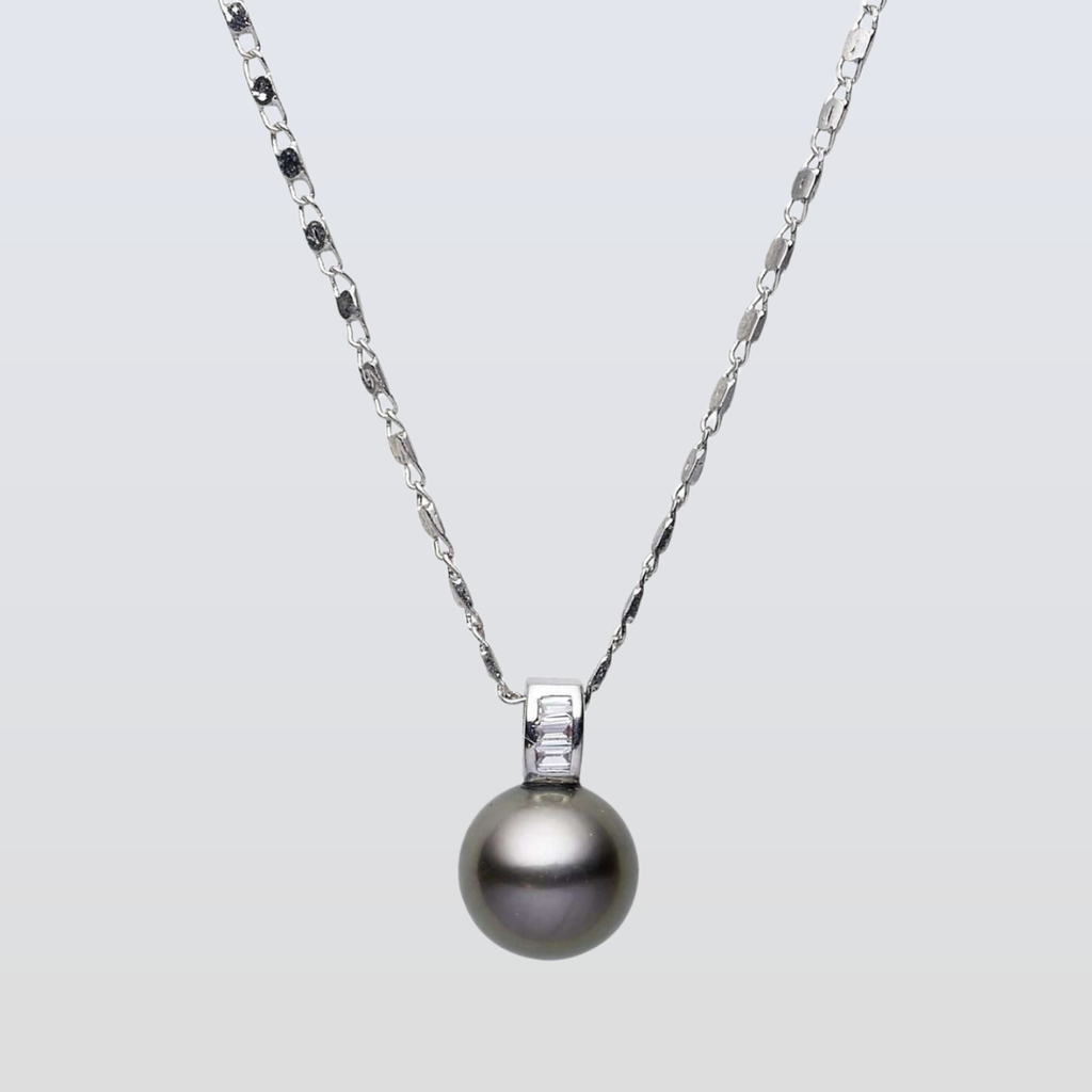 Pearl necklace with a silver chain on a light gray background