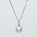 Pearl necklace with a silver chain on a light gray background