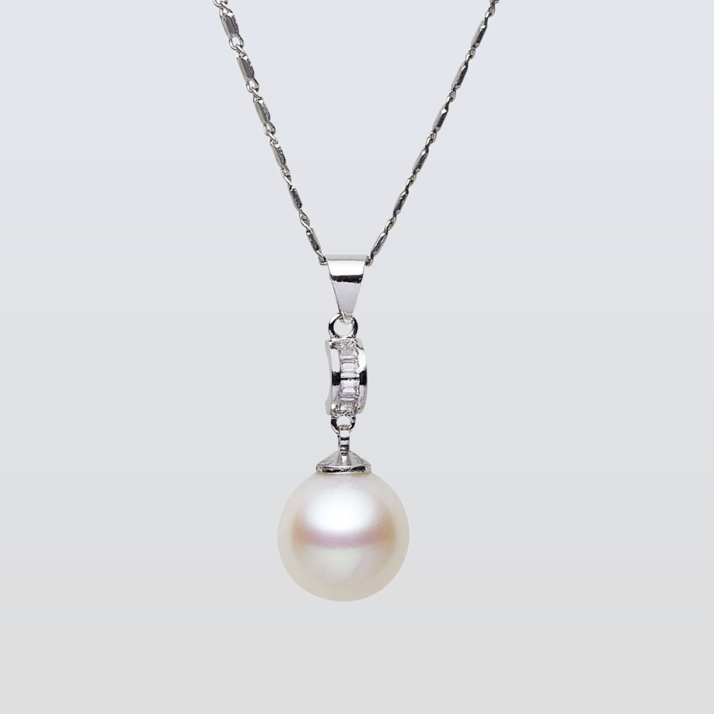 Pearl necklace with a silver chain on a light gray background