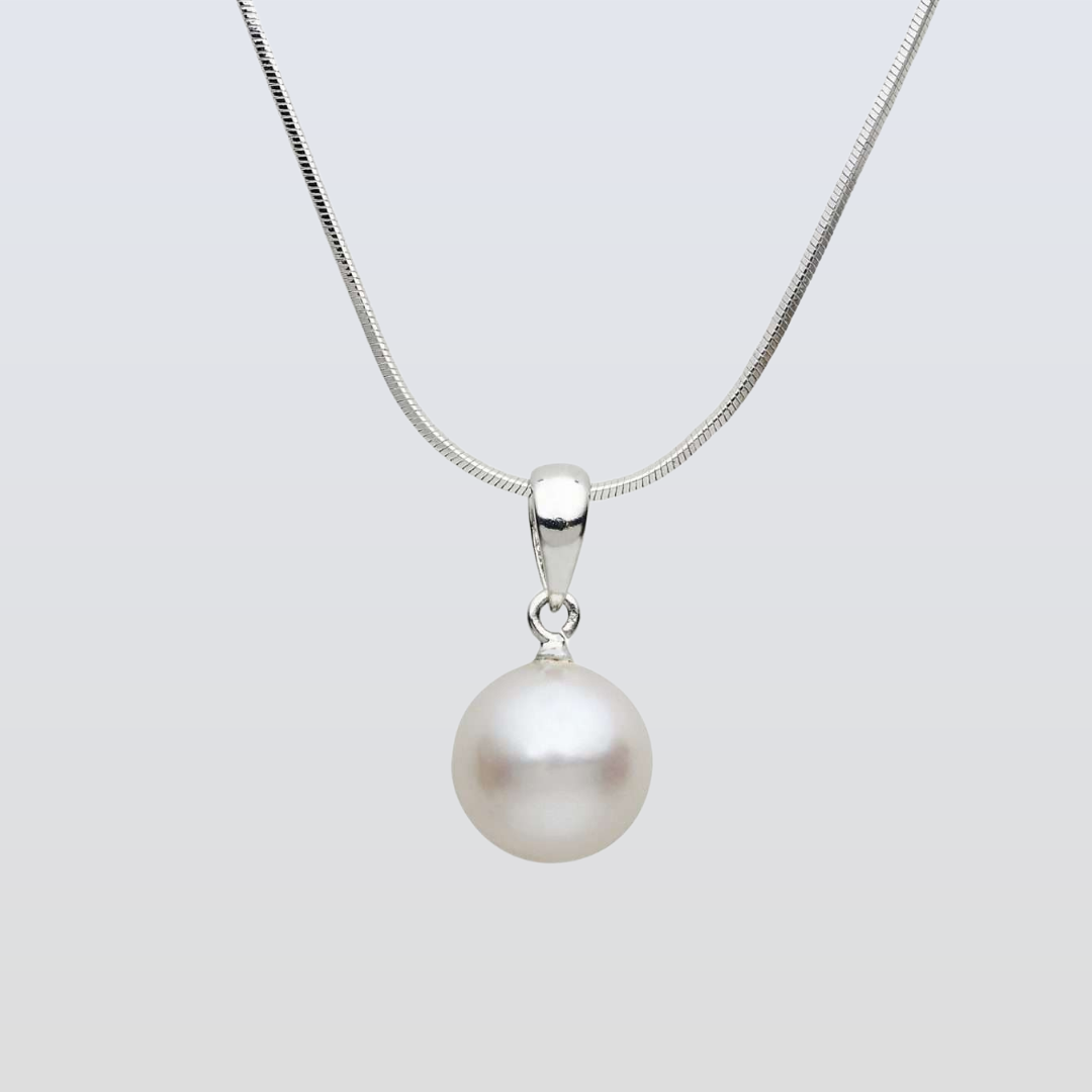 Pearl necklace with a silver chain on a light gray background