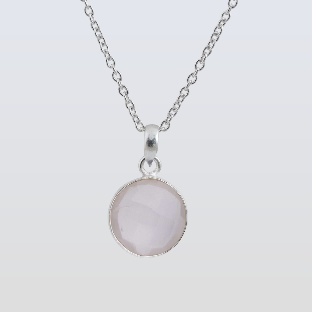 Necklace with a round pendant on a light gray background
