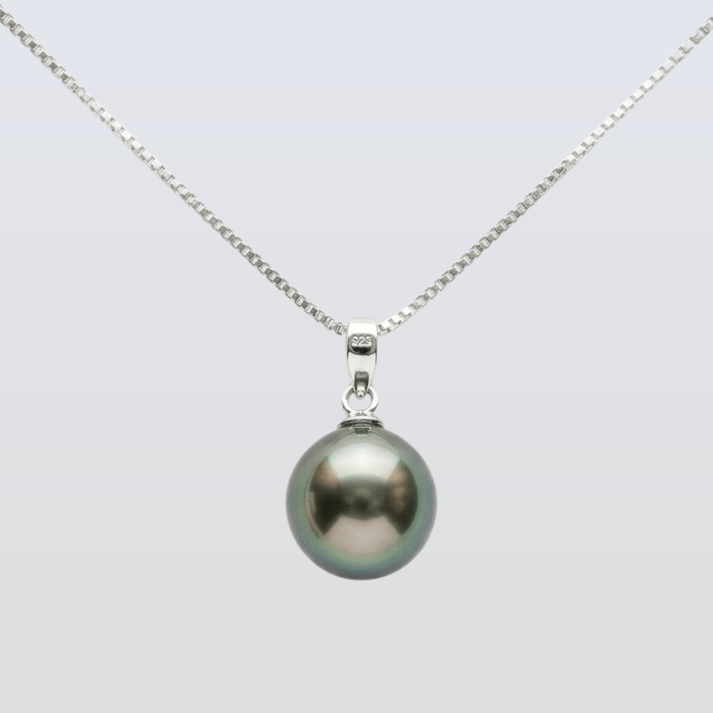 Pearl necklace with a silver chain on a light gray background