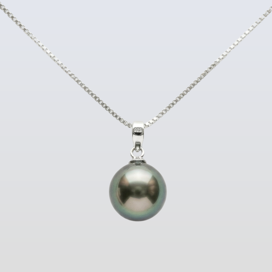 Pearl necklace with a silver chain on a light gray background