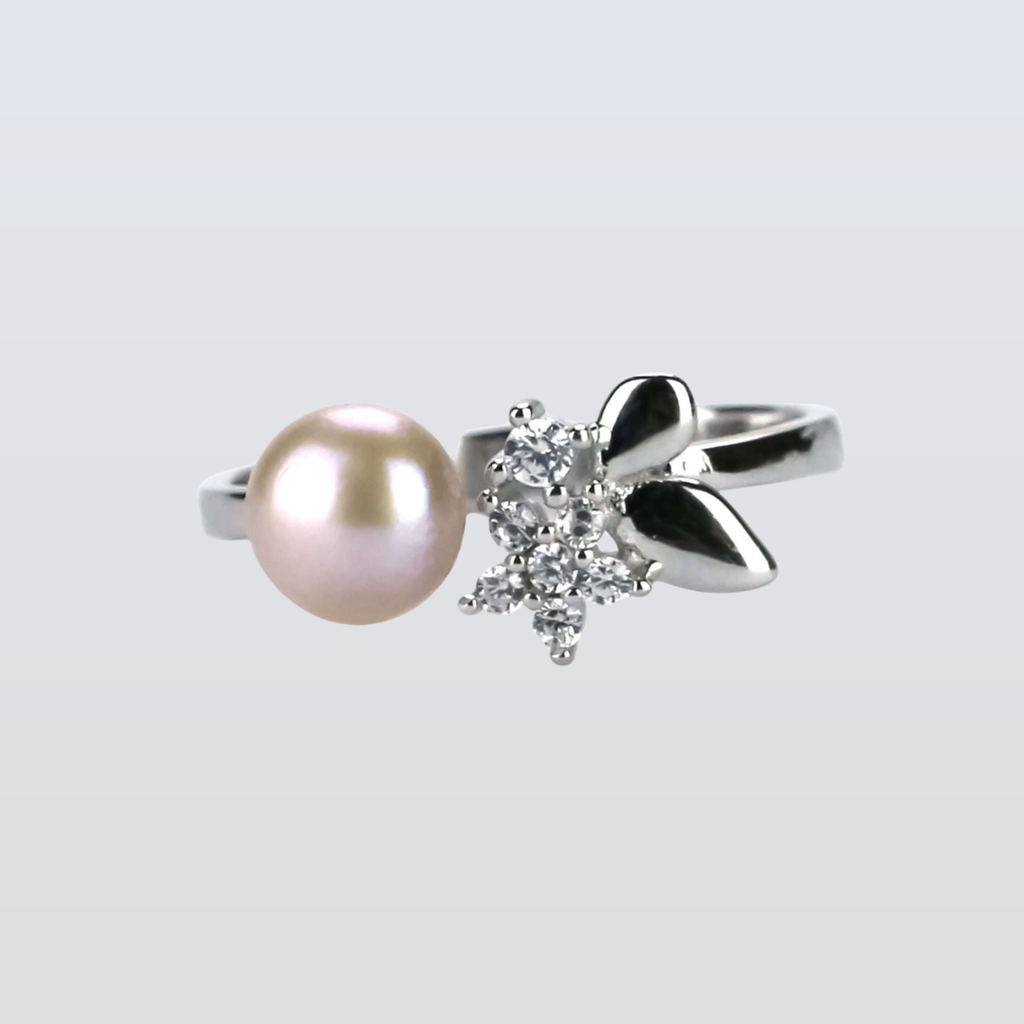  rings with a pearl and diamond design on a light gray background