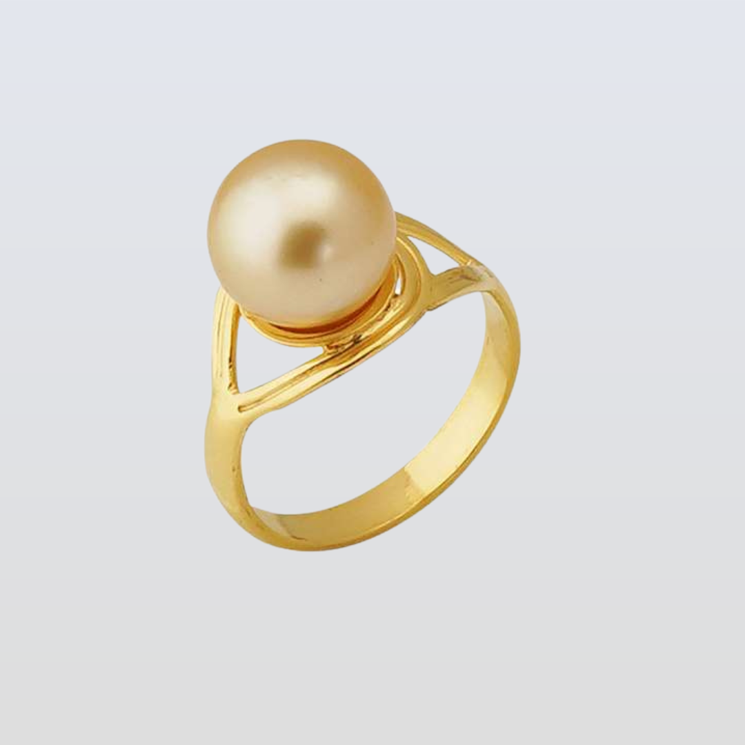 Gold ring with a large pearl on a light gray background