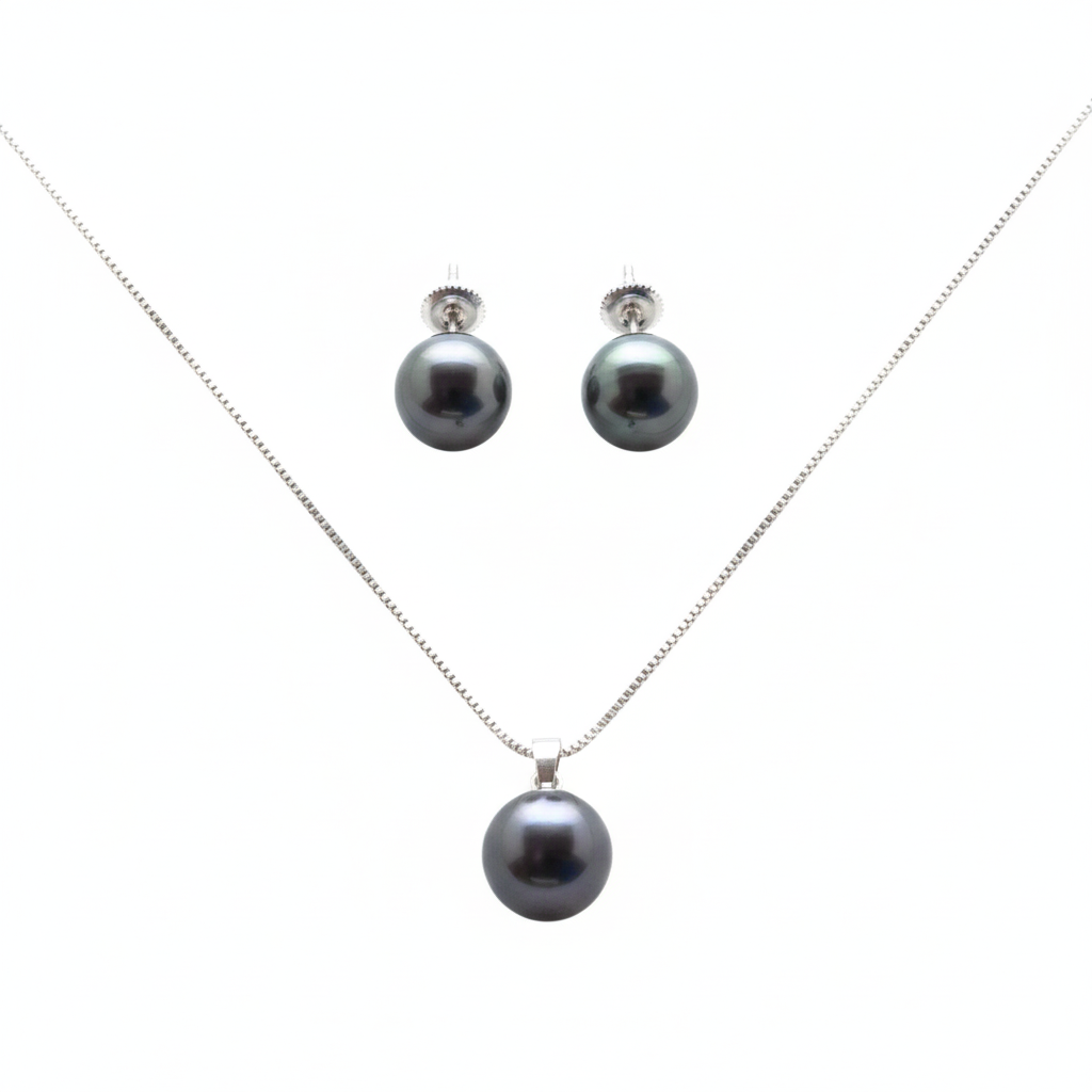 Pearl necklace and earrings set on a white background