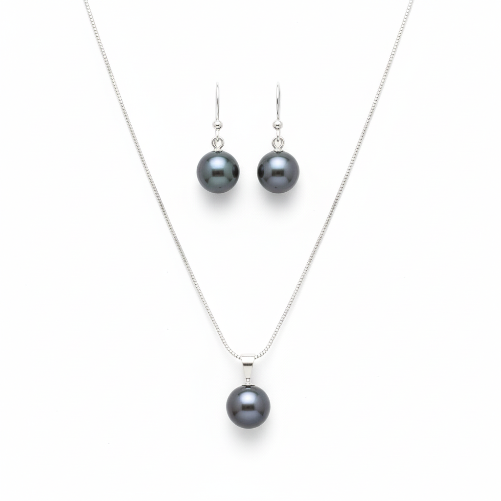 Pearl necklace and earrings set on a white background
