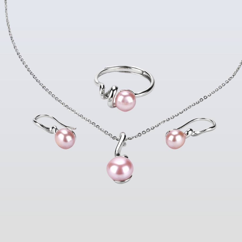 Pearl jewelry set with necklace, ring, and earrings on a light gray background
