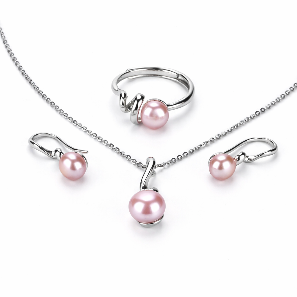 Pearl jewelry set with necklace, ring, and earrings on a white background