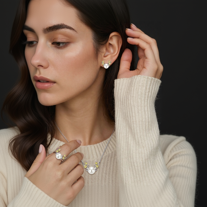 Woman wearing a necklace and earrings with a neutral background