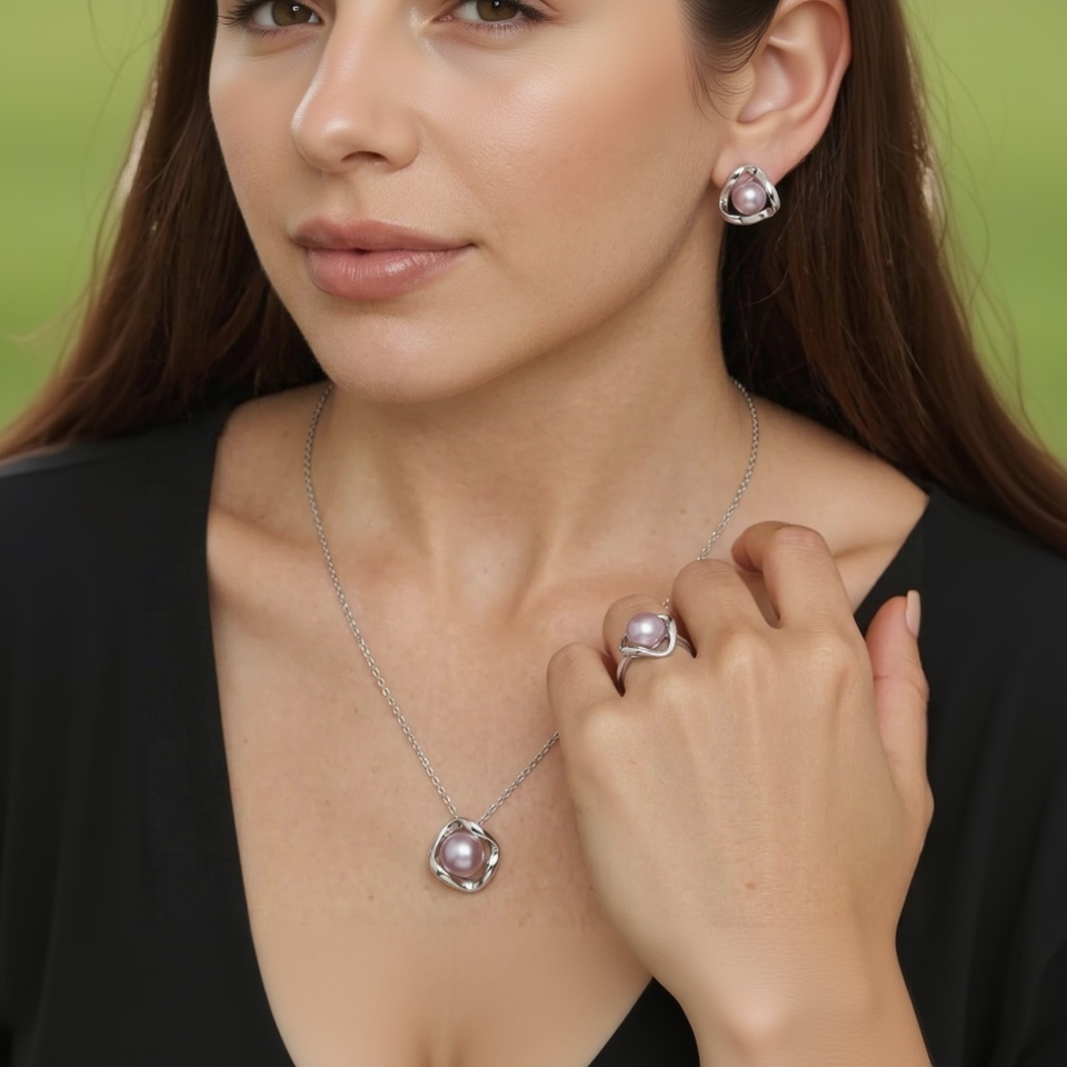 Close-up of a woman wearing a pearl necklace, ring, and earrings.