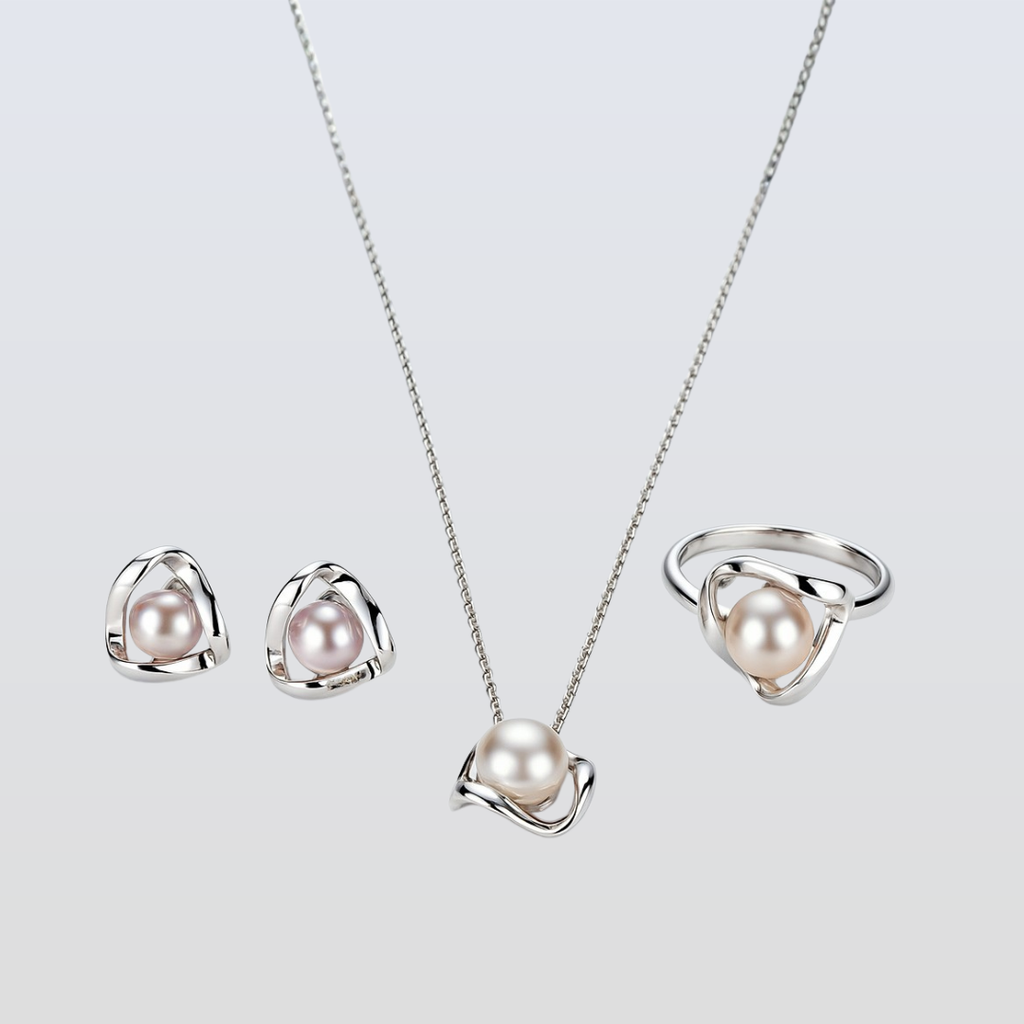 Pearl jewelry set with necklace, earrings, and ring on a light gray background